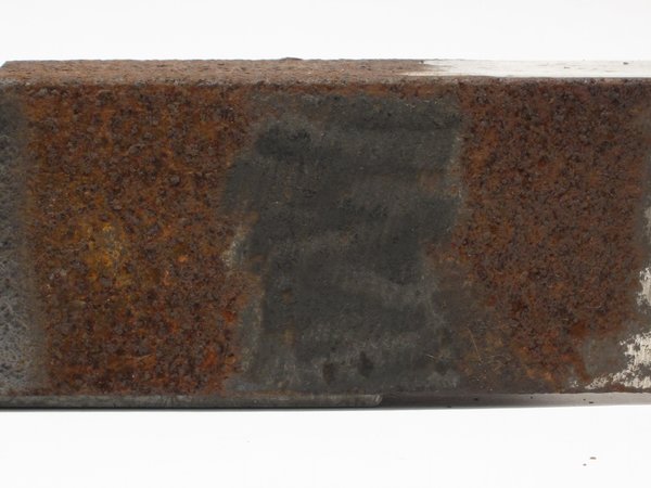 Angle grinder flap disc sanding wheel effect on rusty metal