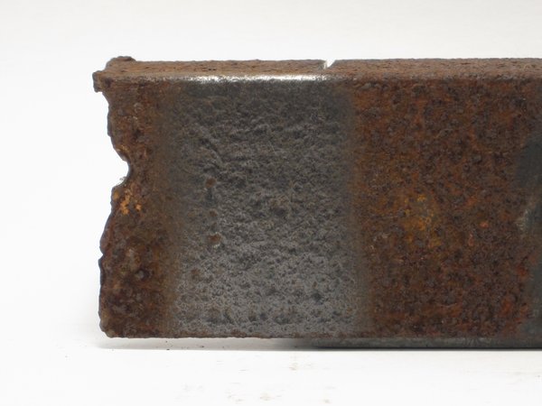 Angle grinder wire wheel effect on rusty metal