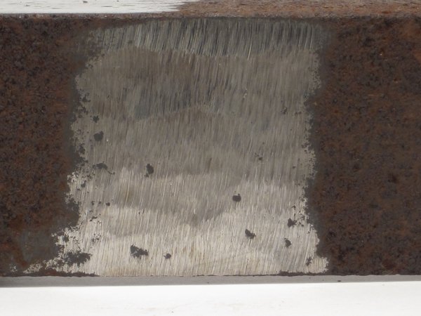 Angle grinder grinding wheel effect on rusty metal